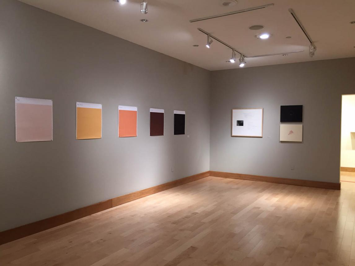 Gallery installation view of seven different pieces displayed on two walls